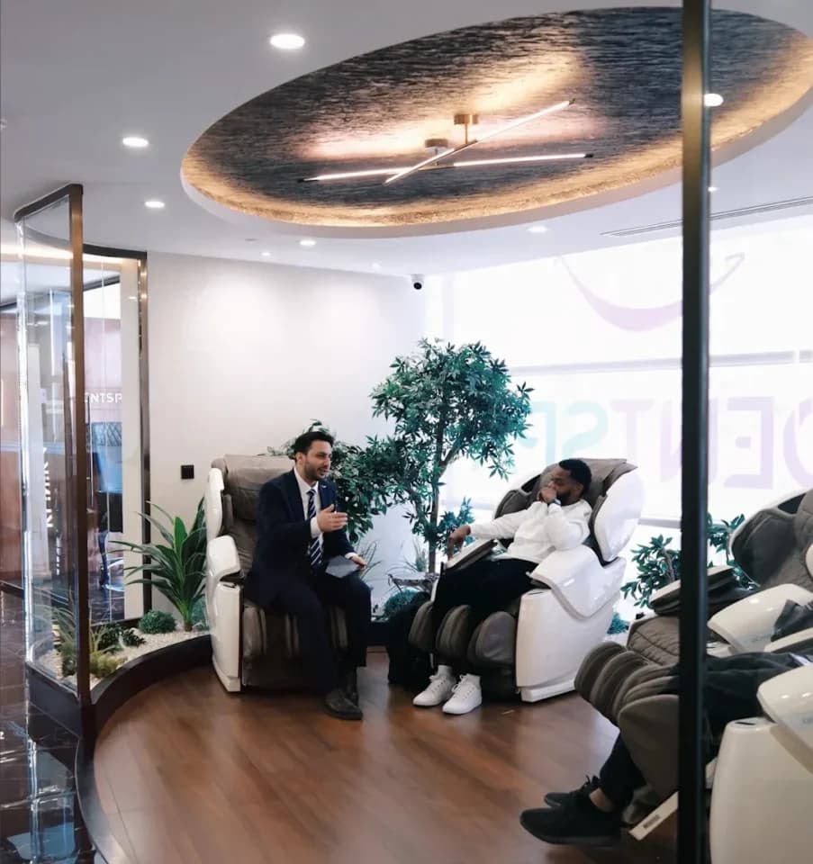 DentSpa lounge with massage chairs, where two patients are relaxing