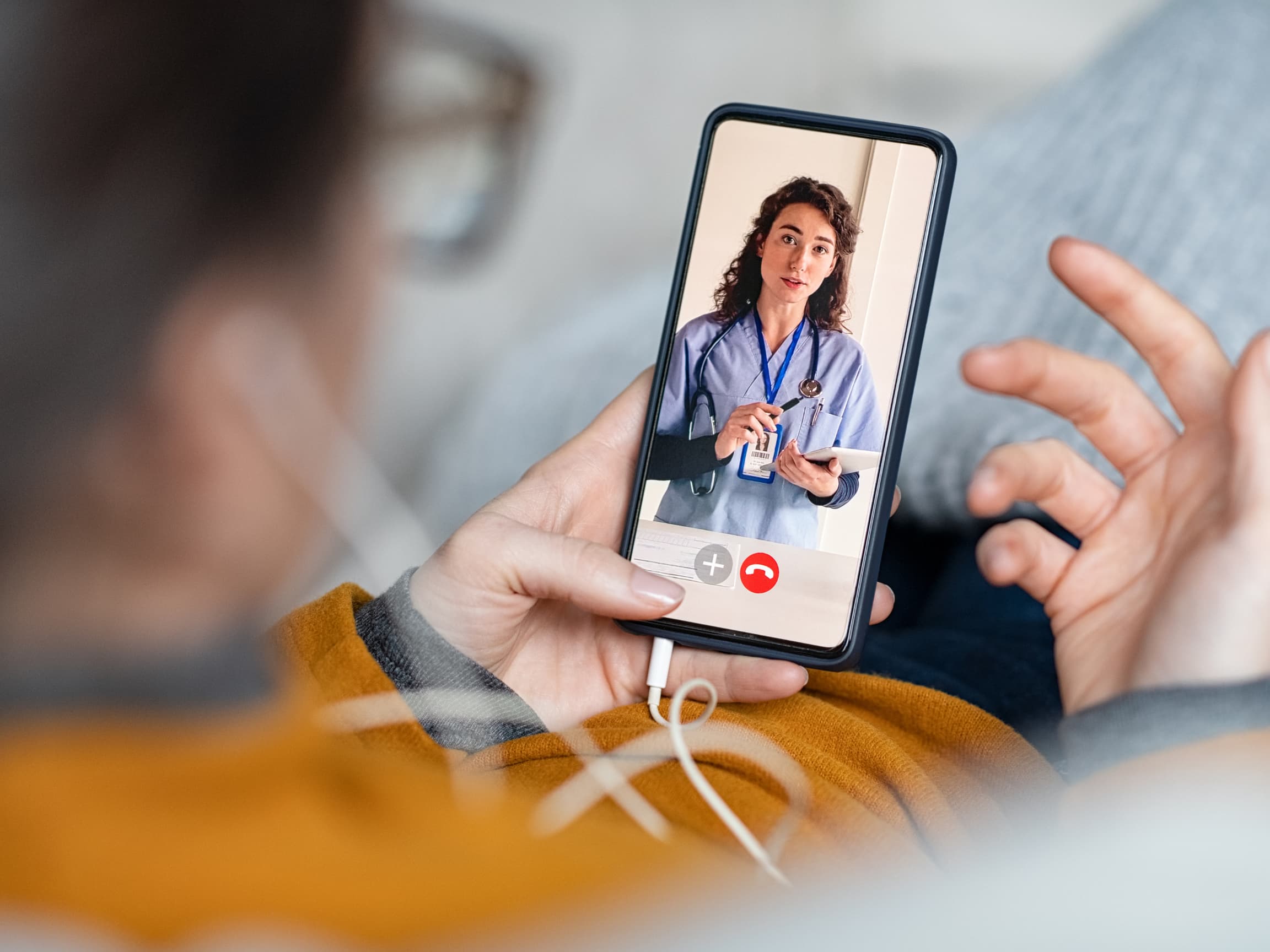 Video consultation with a doctor on a phone