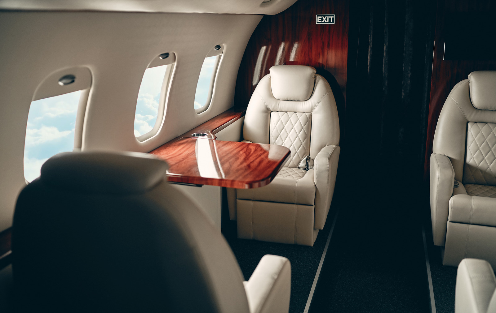 Private jet cabin with cream leather seats